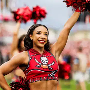 Coupé Alum performs as NFL cheerleader